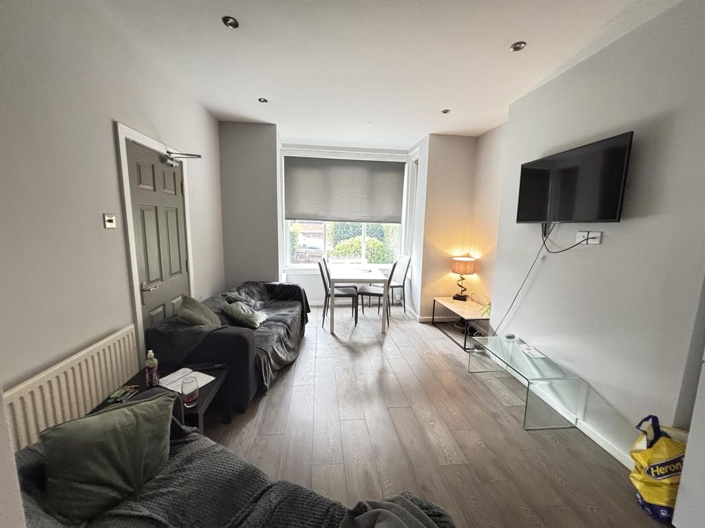 Property photo 3 of 24 A Spacious And Modern Living Room With Ample Natur...