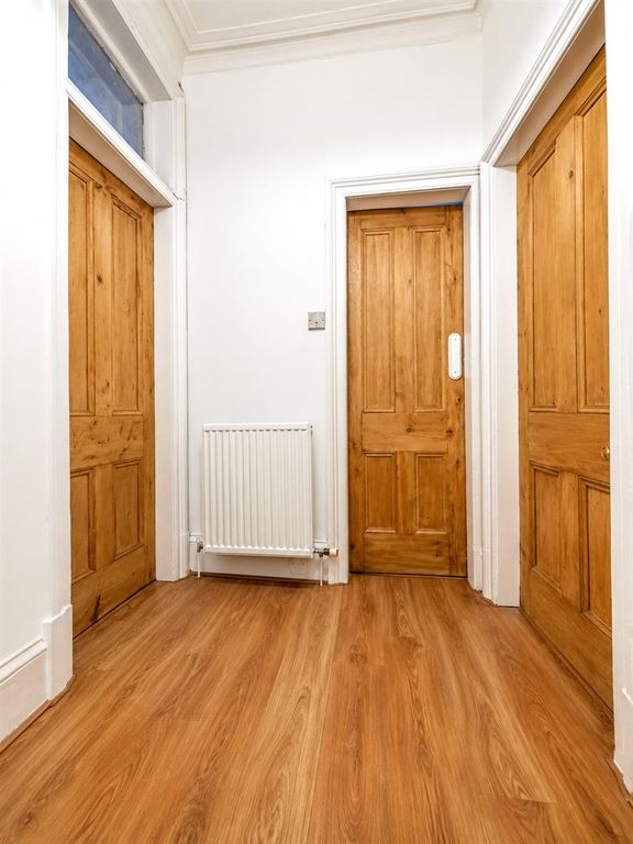 Property photo 2 of 12 Bright Oak Doorway Hallway.Png