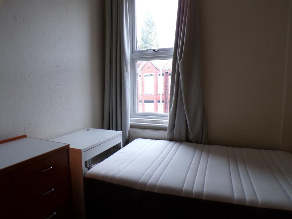 Property photo 3 of 9 A Cozy Single Bedroom Featuring A Large Window Tha...