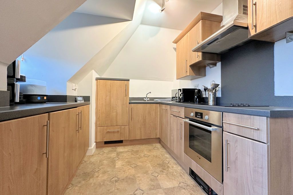 Property photo 3 of 13 Kitchen Area