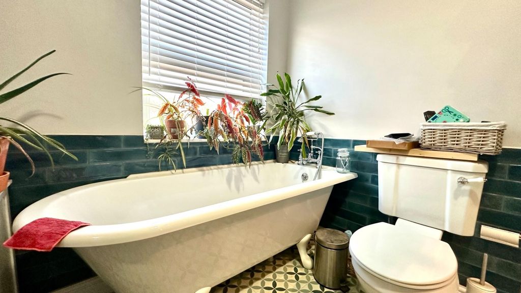 Property photo 2 of 6 Elegant Roll Top Bath With Stylish Teal Tiling...