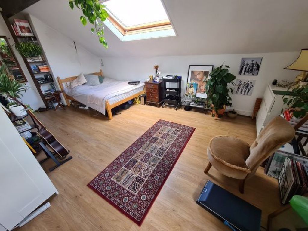 Property photo 3 of 13 Bright And Inviting Living Room With Ample Natural...