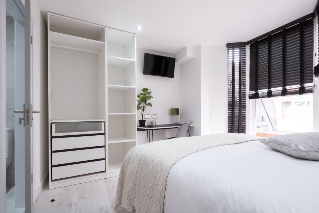 Property photo 3 of 14 Bright And Modern Master Bedroom Featuring A Comfo...