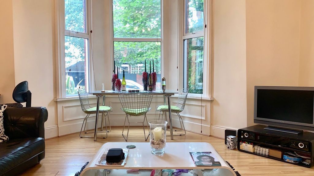Property photo 3 of 14 A Bright And Inviting Living Room Featuring A Larg...