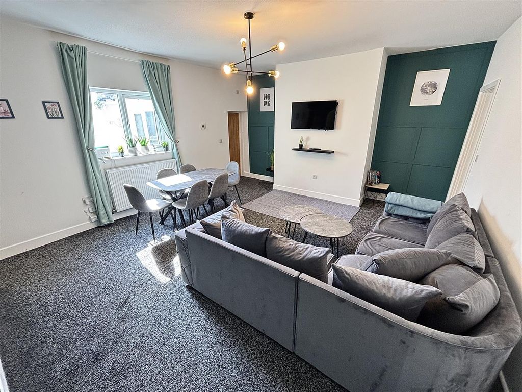 Property photo 1 of 12 Living Area