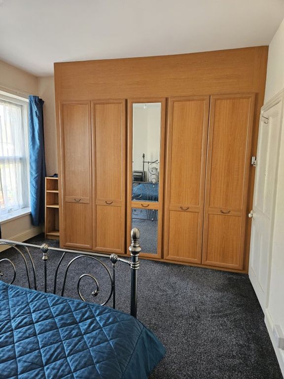 Property photo 3 of 9 A Cozy Double Bedroom Featuring Ample Storage With...