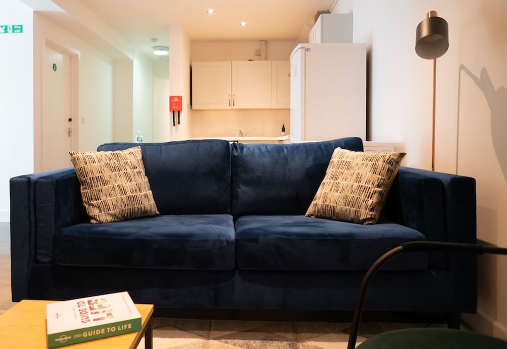 Property photo 3 of 5 A Cozy And Inviting Living Room Featuring A Stylis...