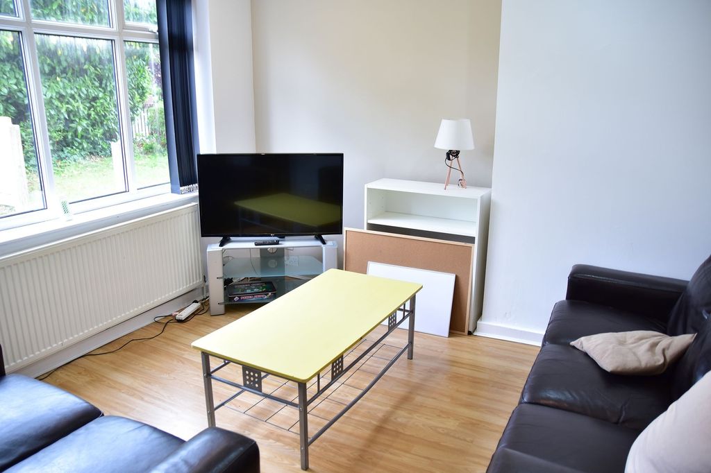 Property photo 2 of 7 Bright And Welcoming Living Room Featuring A Large...