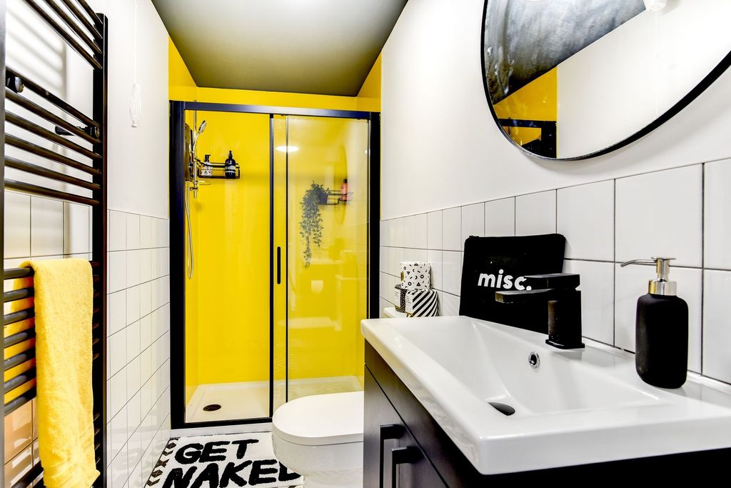 Property photo 1 of 5 This Stylish Bathroom Features A Modern Design Wit...