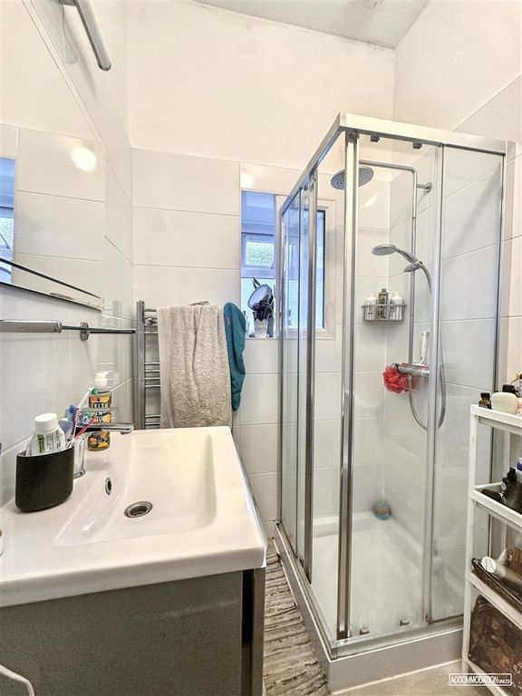 Property photo 1 of 7 Bright Modern Shower With Stylish White Tiling...