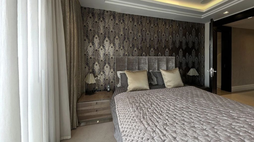 Property photo 3 of 24 A Stylish Master Bedroom Featuring A Plush Double ...