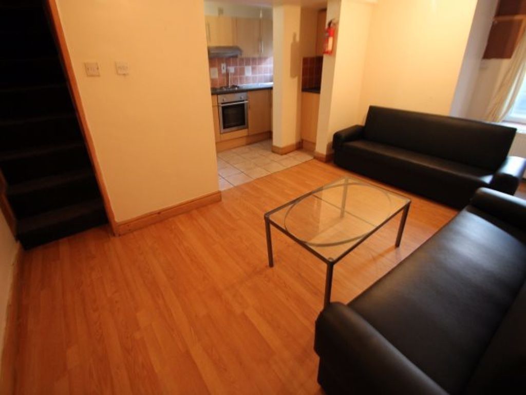 Property photo 3 of 13 A Bright And Welcoming Living Room Featuring Conte...