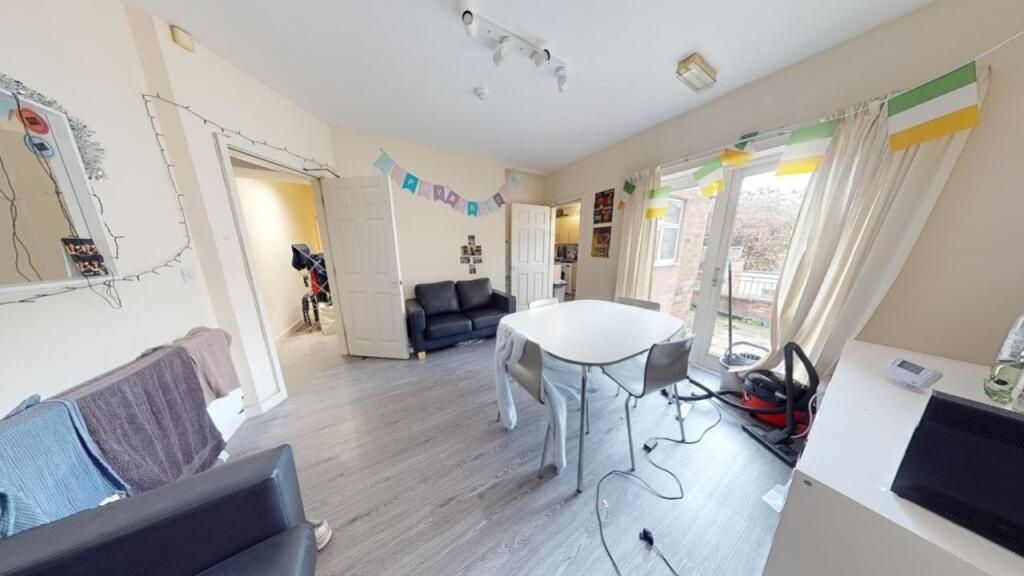 Property photo 2 of 13 Bright And Airy Living Room Featuring Modern Floor...