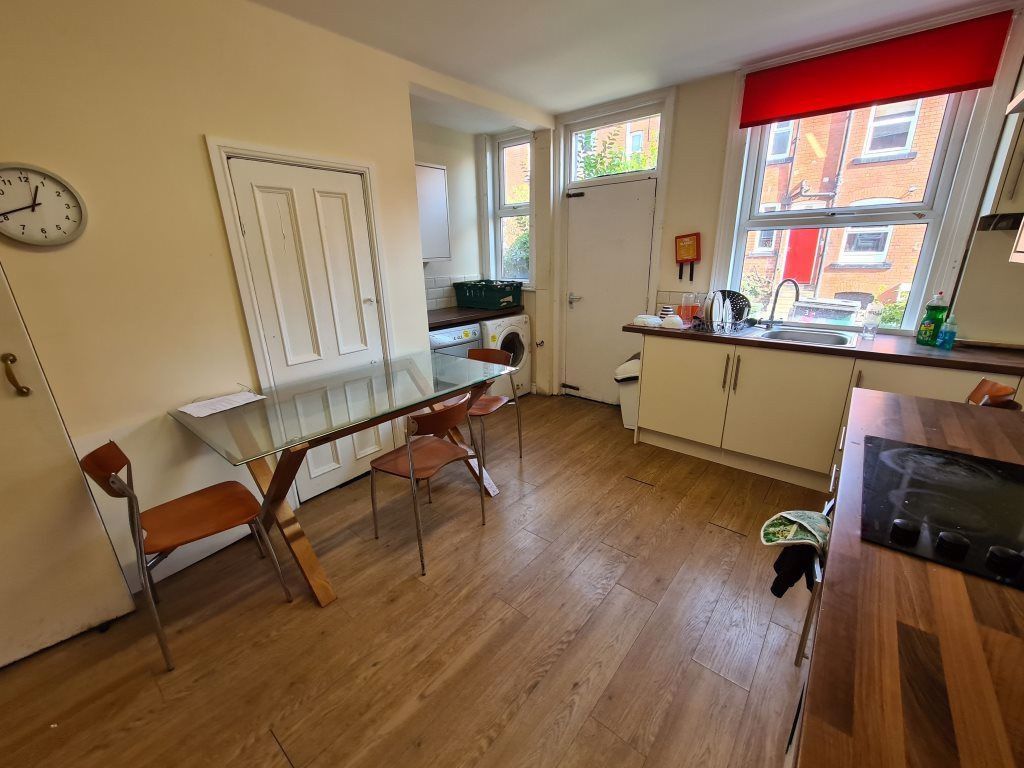 Property photo 1 of 14 A Spacious And Well-Lit Living Room Featuring Larg...