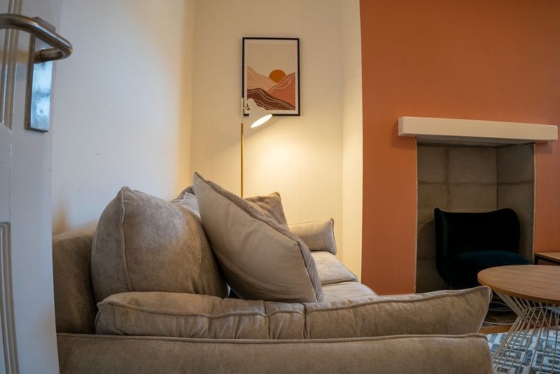 Property photo 3 of 8 A Cozy And Inviting Living Room Featuring A Comfor...