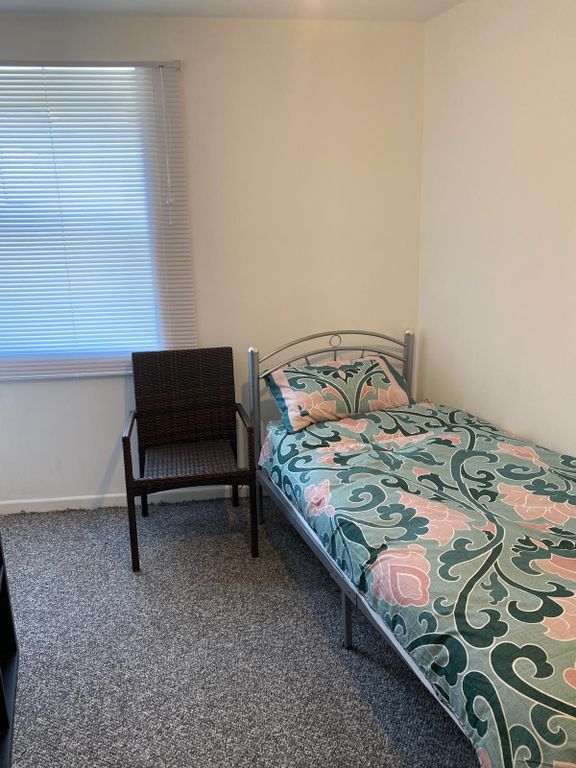 Property photo 3 of 9 Bright Bedroom With Patterned Bedding And Window...