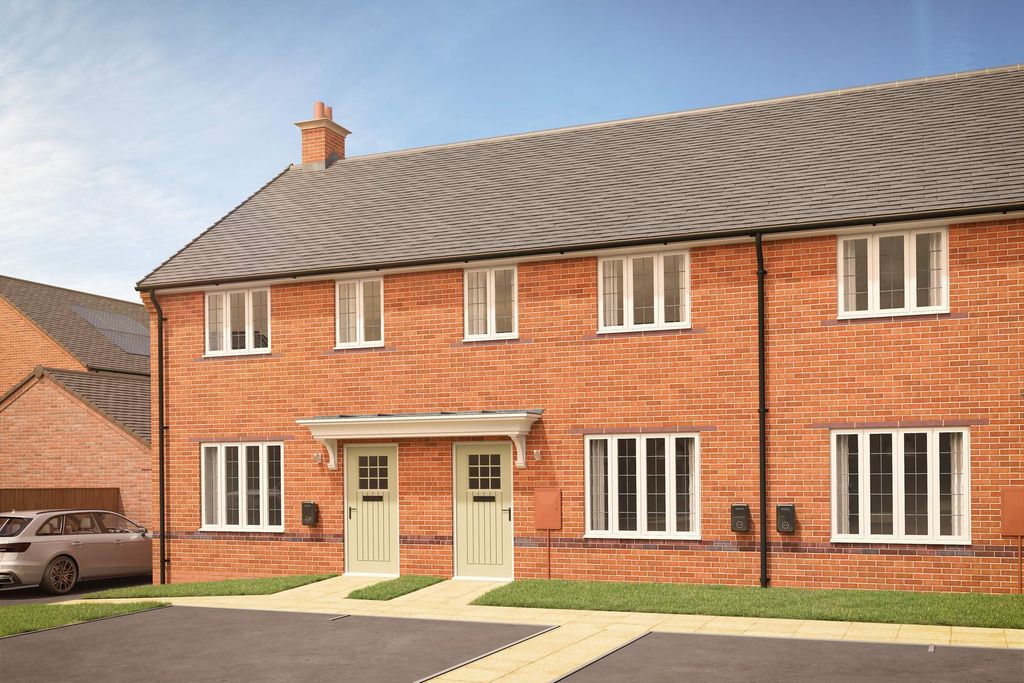 Property photo 1 of 7 A Row Of Modern Brick Townhouses With Light Green Doors Stands In The Foreground