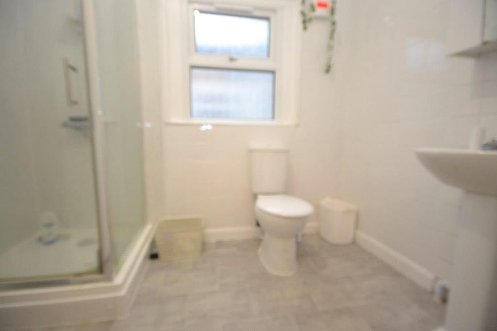 Property photo 2 of 12 A Clean But Slightly Cluttered Bathroom Featuring ...