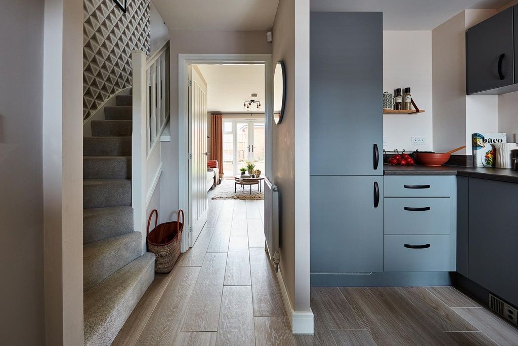 Property photo 3 of 10 The Kitchen Is Located Off The Hallway