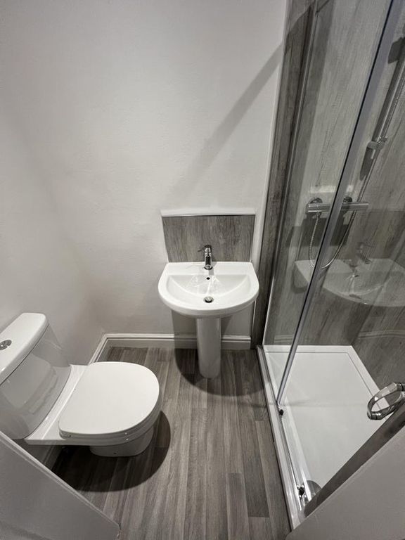 Property photo 2 of 10 Modern Bathroom Featuring A Sleek Shower Enclosure...