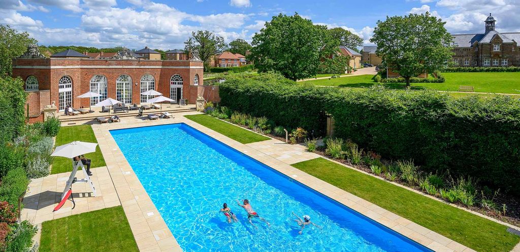 Property photo 1 of 1 An Image Of People Using The Outdoor Swimming Pool At The Lawn Club
