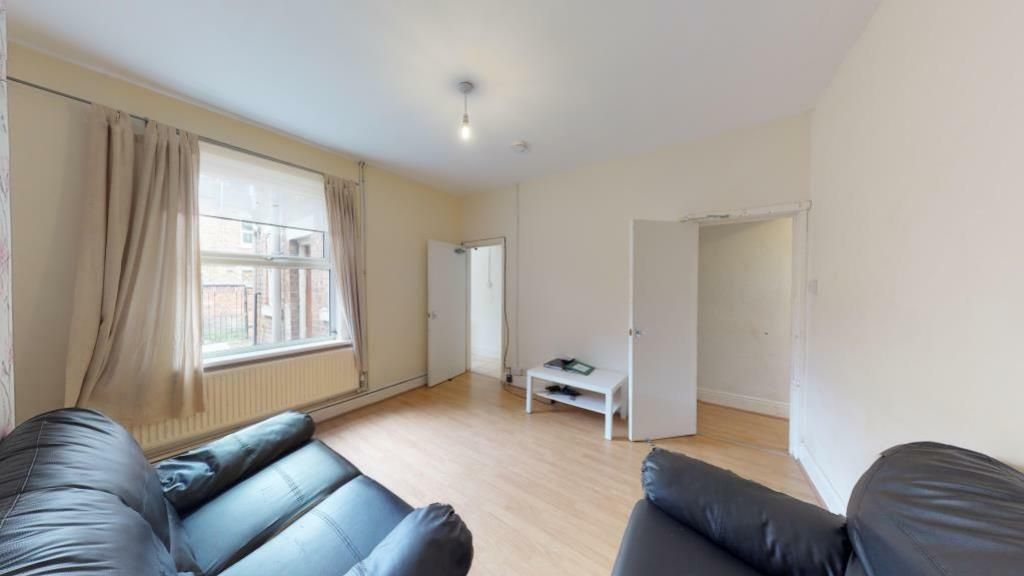 Property photo 1 of 7 Bright And Inviting Living Room With Ample Natural...