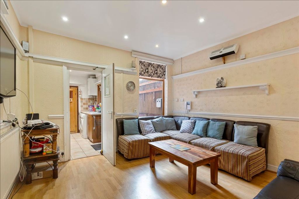 Property photo 3 of 12 A Spacious And Inviting Living Room Adorned With c...