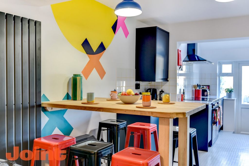 Property photo 3 of 6 Bright, Contemporary Kitchen With A Large Wooden i...