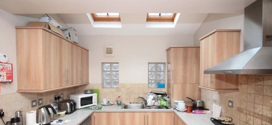 Property photo 2 of 7 Modern Galley-Style Kitchen With Light Wood Cabine...