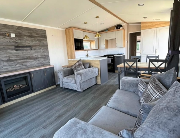 Property photo 2 of 10 Swift Provence Open Plan Lounge With Grey Seating, Fireplace And Dining Area