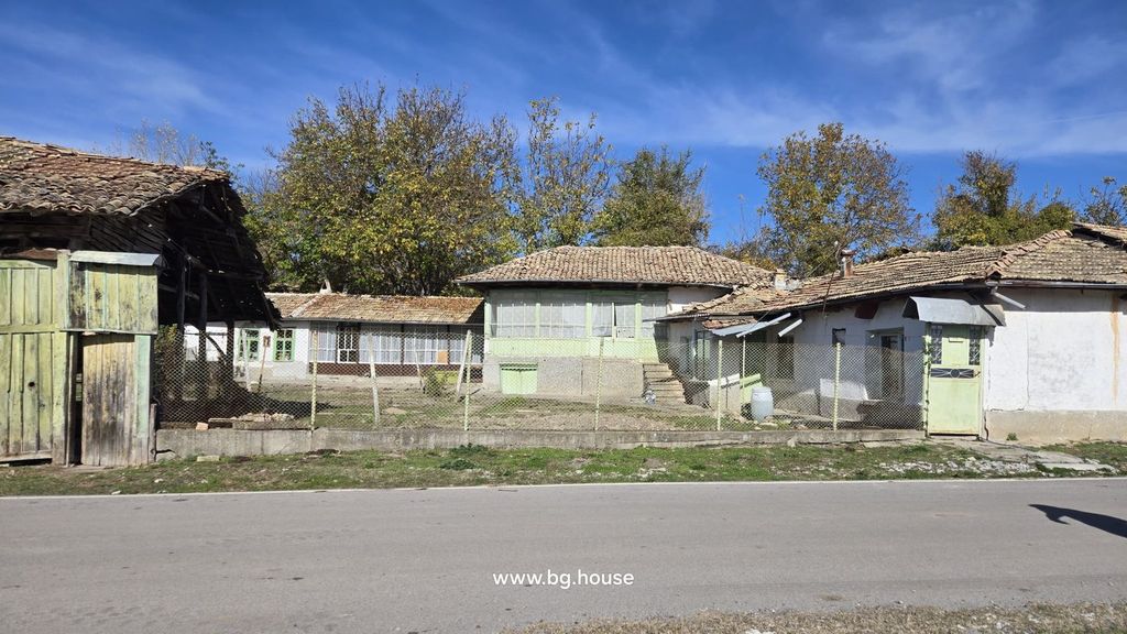 Property photo 1 of 58 Front View Of A Traditional Bulgarian House With Multiple Tiled Roofs And A Fenced Yard In Kovachevets Village