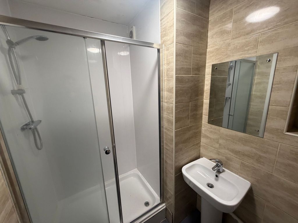 Property photo 1 of 58 Modern Tiled Bathroom With A Glass-Enclosed Shower...