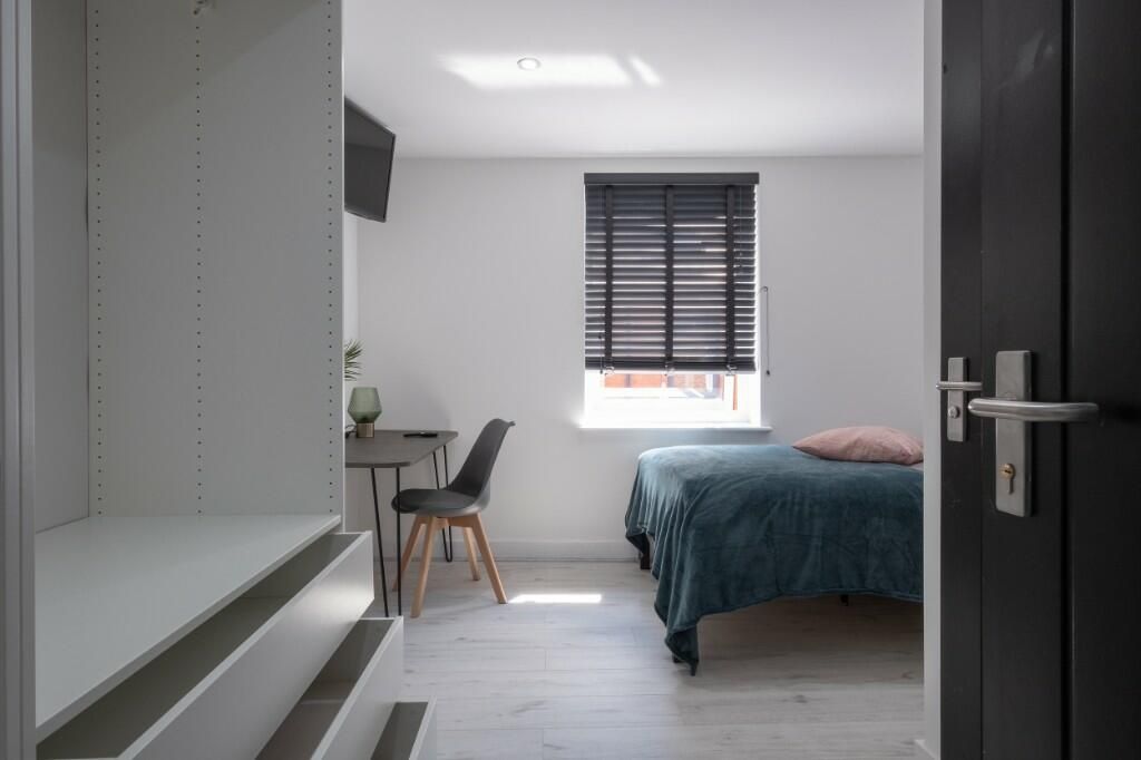 Property photo 3 of 15 A Bright And Modern Bedroom Featuring A Comfortabl...