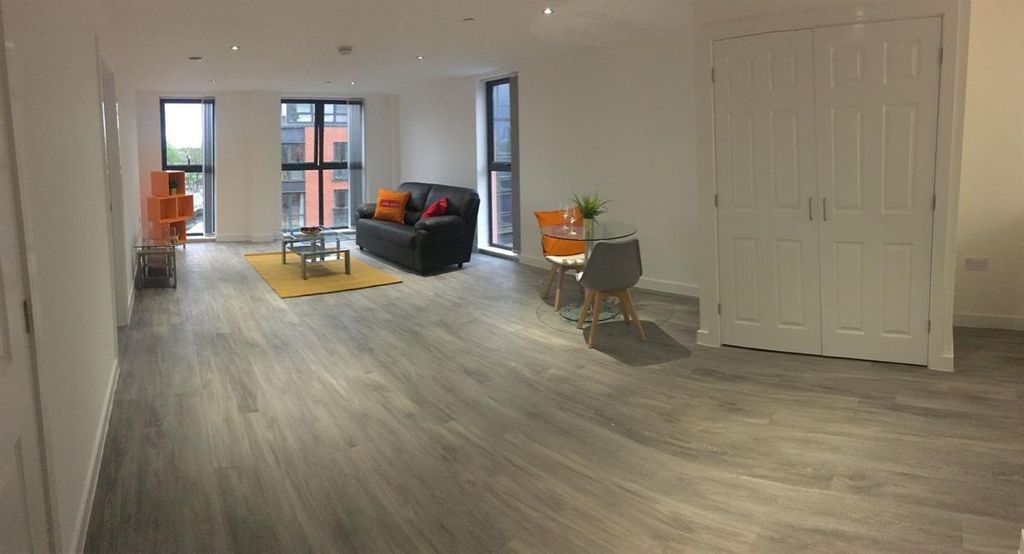 Property photo 1 of 5 A Spacious And Modern Living Room With Large Windo...