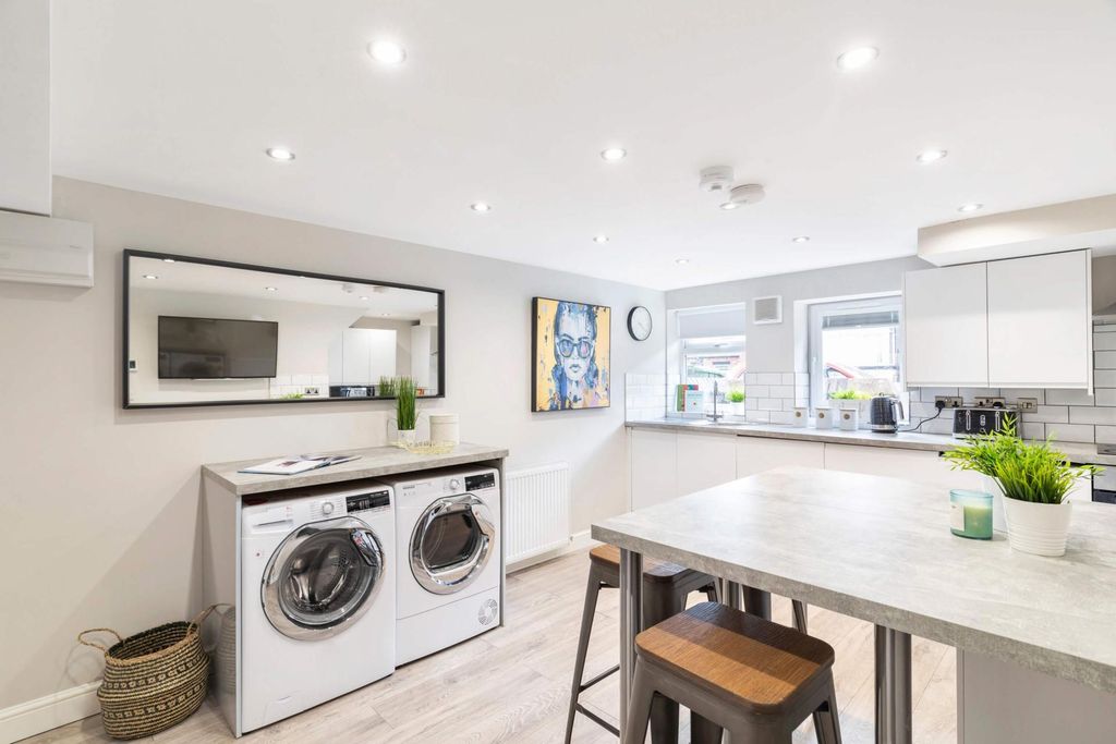 Property photo 2 of 9 A Spacious, Modern Living Room Featuring Bright Na...