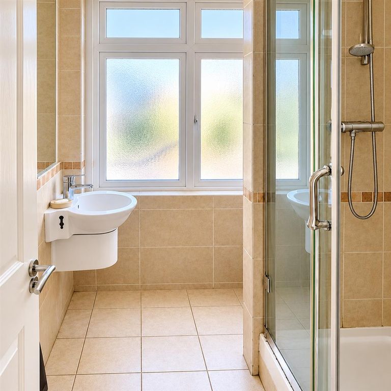 Property photo 2 of 6 Bright Modern Beige-Tiled Bathroom.Png