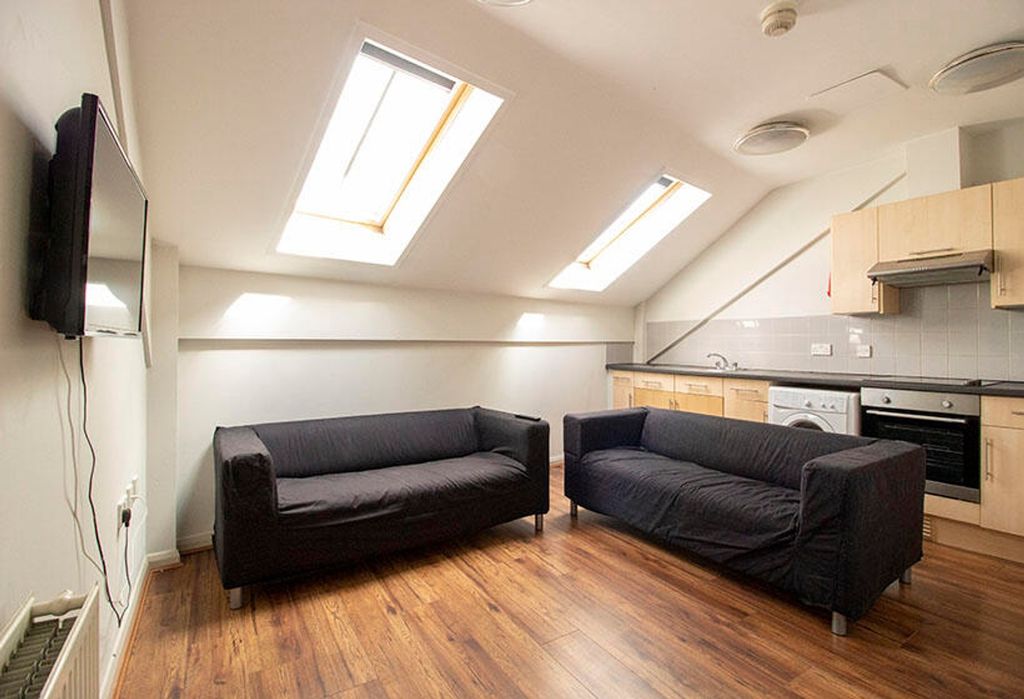 Property photo 1 of 4 A Bright And Inviting Living Room Featuring Two Co...