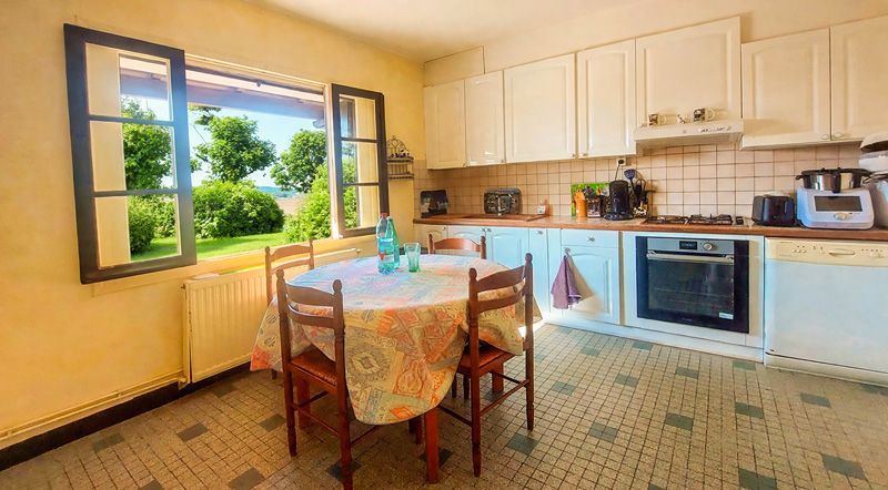 Property photo 3 of 30 Lush_Garden_Kitchen_View