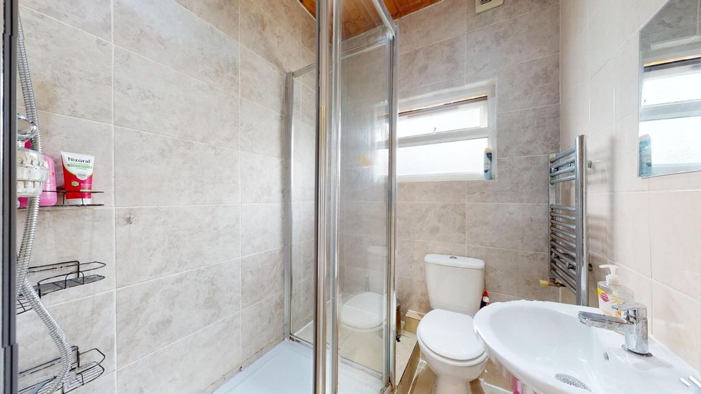 Property photo 1 of 7 Bright, Modern Bathroom With A Glass Shower Enclos...