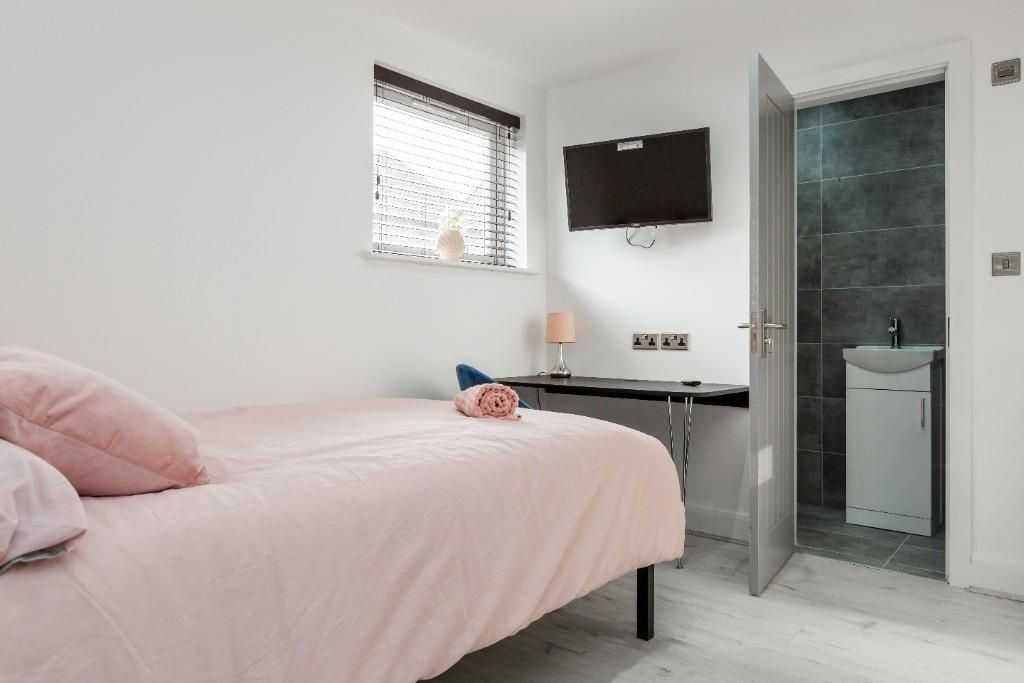 Property photo 2 of 15 Bright And Modern Master Bedroom Featuring A Comfo...