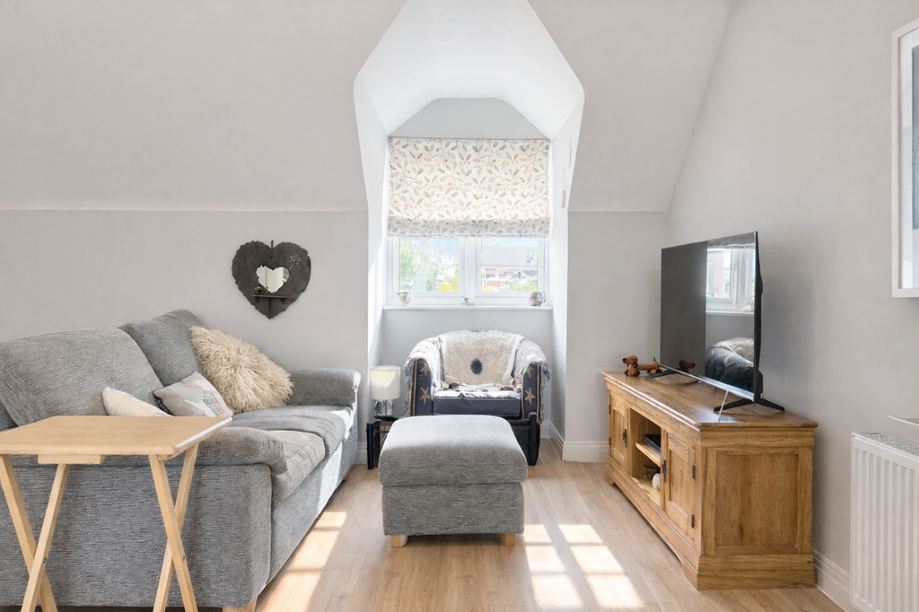 Property photo 2 of 10 Cozy Attic Living Room With Natural Light