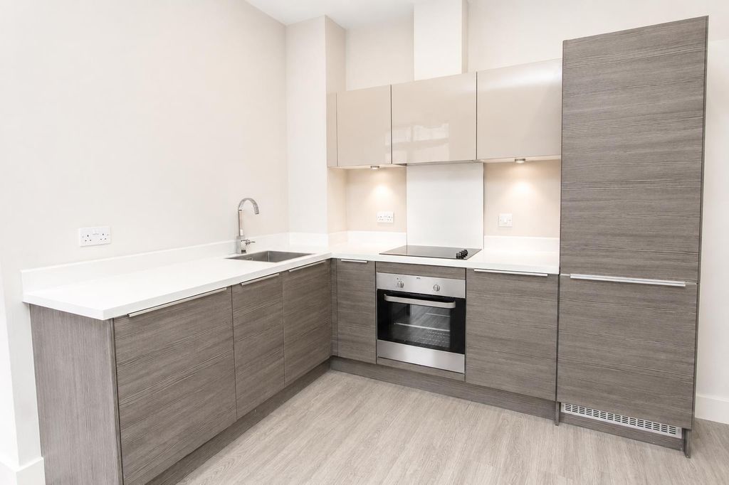 Property photo 2 of 10 Modern Kitchen With Sleek Wood-Finish Cabinets...