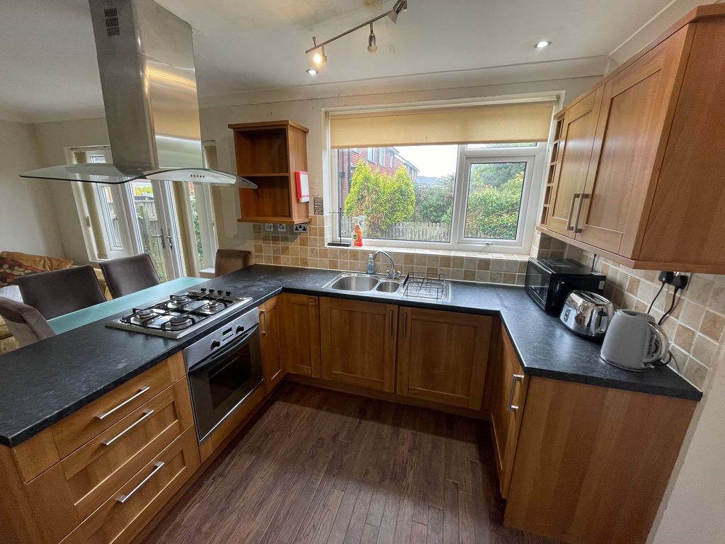 Property photo 3 of 9 Bright And Well-Equipped Kitchen Featuring Wooden ...