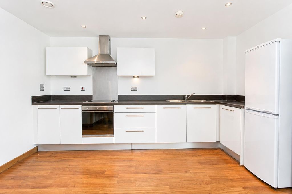 Property photo 3 of 12 Bright Modern Kitchen With Sleek White Cabinets...