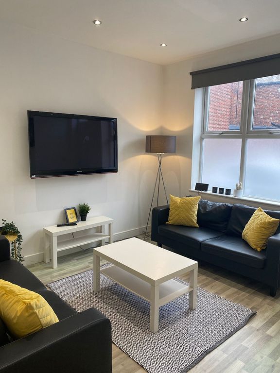 Property photo 1 of 17 Bright, Modern Living Room With Two Black Leather ...