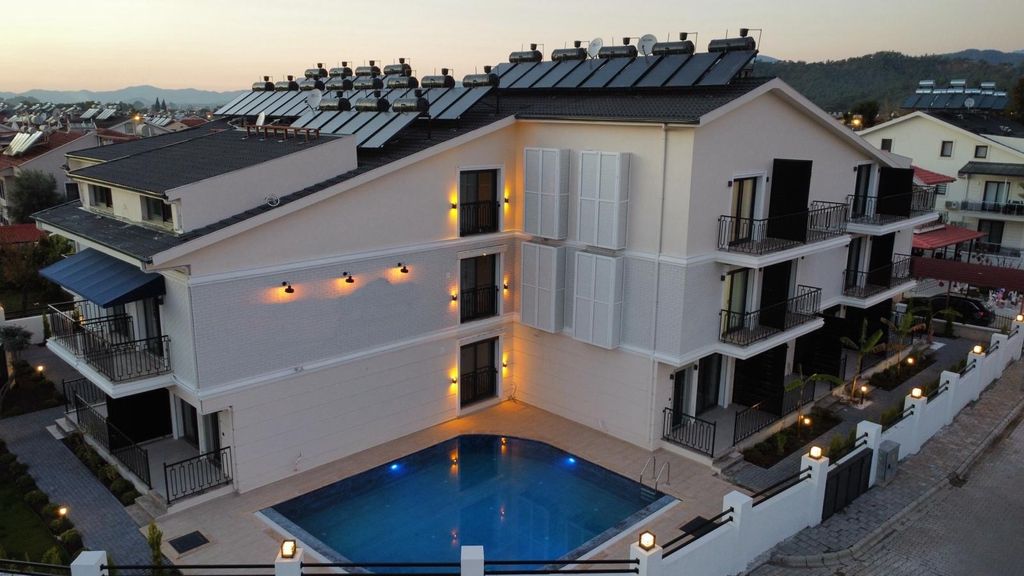 Property photo 2 of 16 Luxury Property For Sale In Fethiye - Communal Pool And Gardens