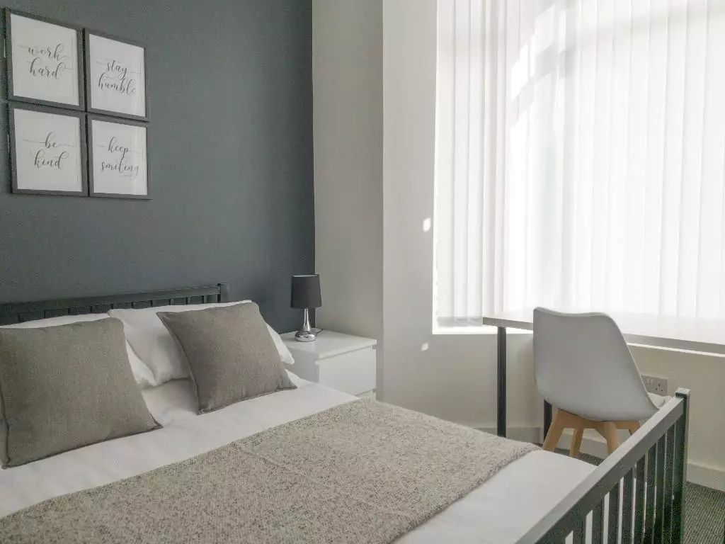 Property photo 1 of 9 Bright And Stylish Master Bedroom Featuring A Comf...