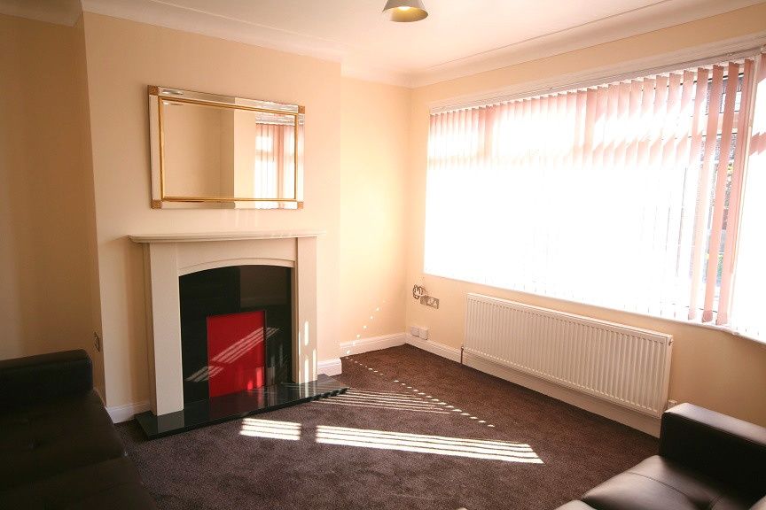 Property photo 2 of 5 Bright And Spacious Living Room Featuring A Large ...