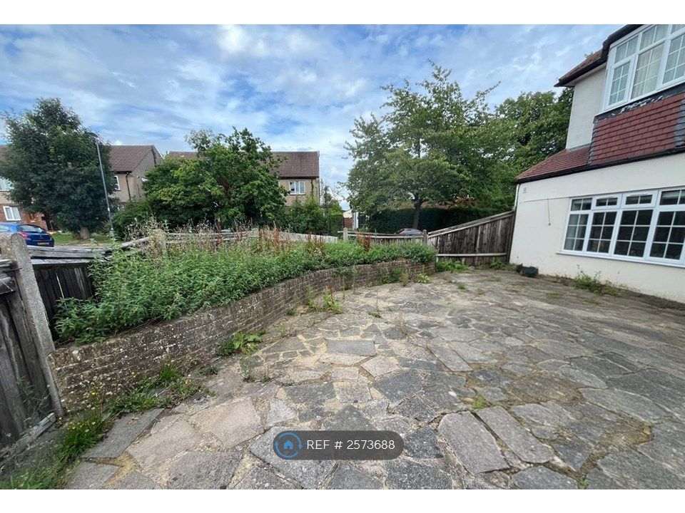 Property photo 2 of 33 Front Side View With Garden Patch
