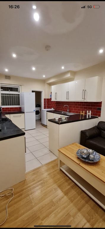 Property photo 1 of 29 Bright Open-Plan Kitchen Area With Modern White Ca...